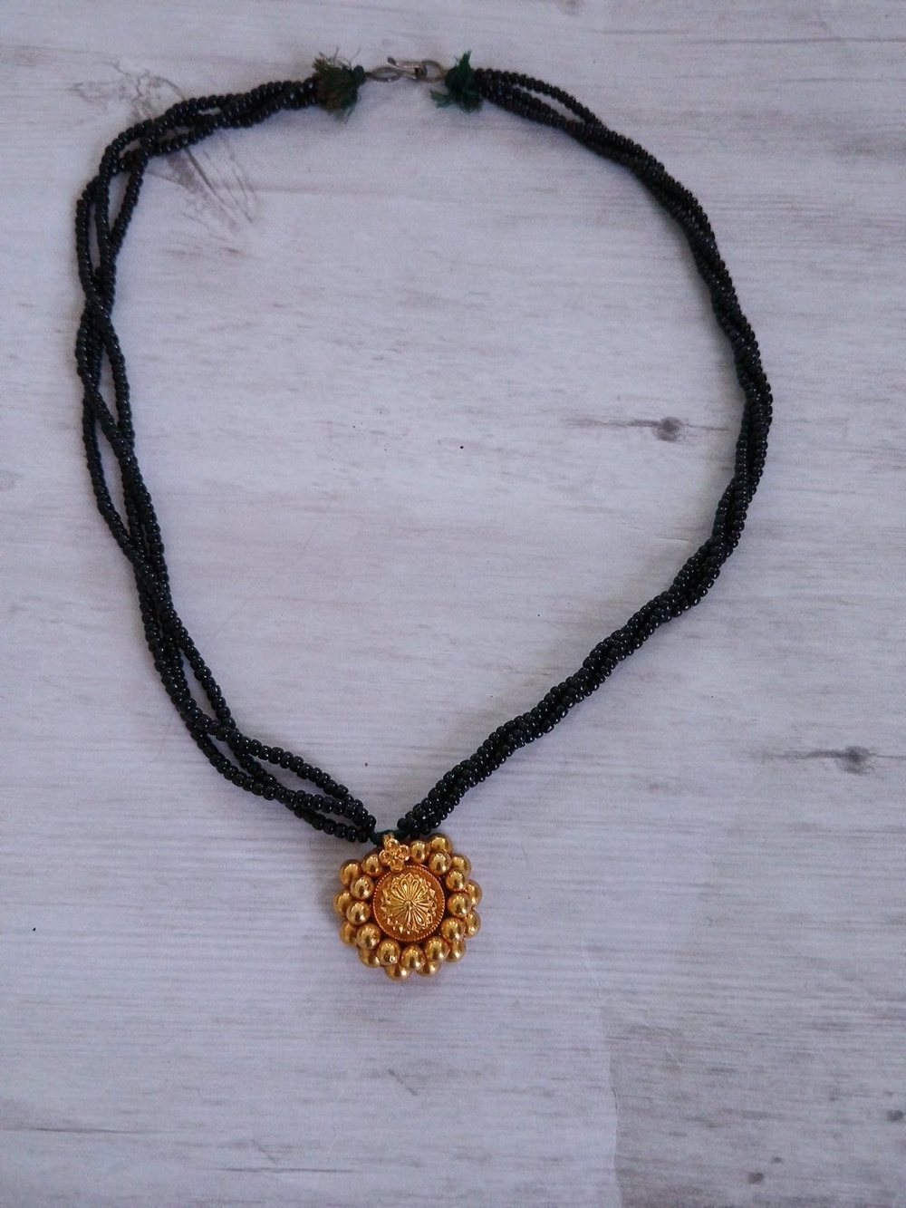 Black Beaded Necklace with Gold Floral Medallion - Picture 3 of 3